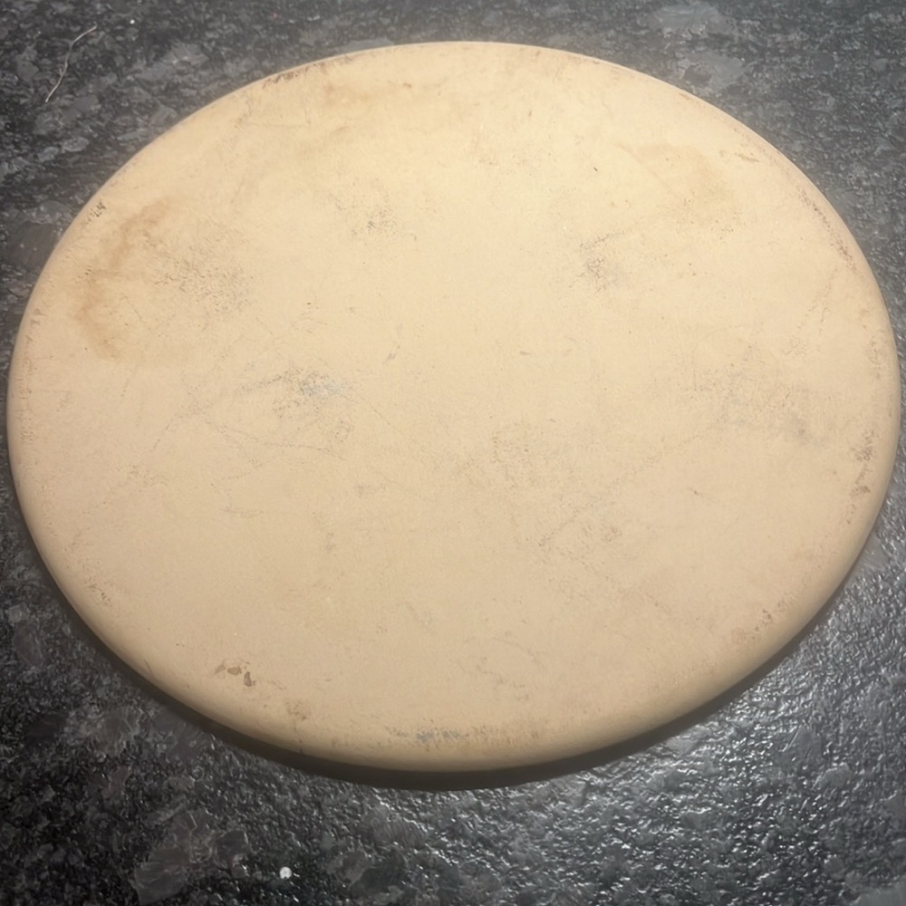 - STONE. CLASSIC ROUND by Pampered Chef. 13 round. Partially seasoned